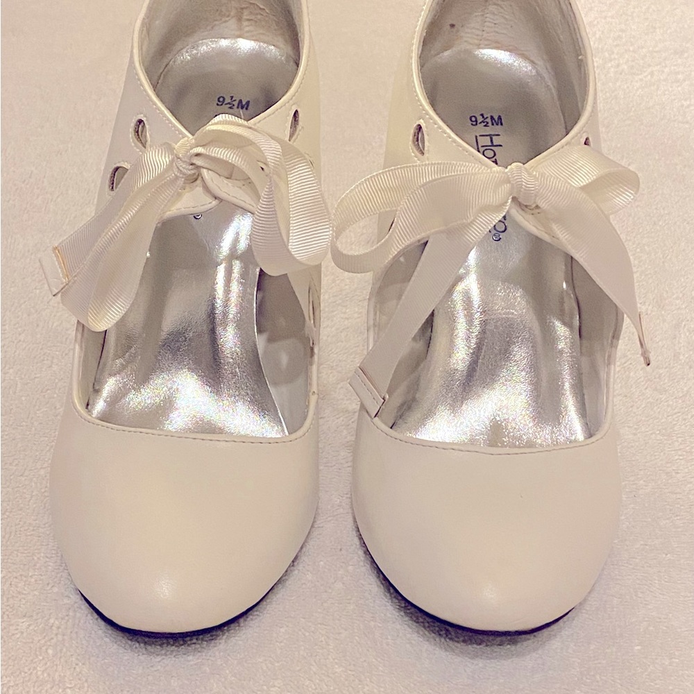 Woman size 9 1/2-Medium; white leather pumps; Used